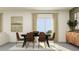 Well-lit dining area with a modern table and seating at 17611 Happytrails St, Land O Lakes, FL 34638