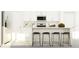 Bright kitchen with white cabinets, stainless steel appliances, a breakfast bar with seating, and granite countertops at 17611 Happytrails St, Land O Lakes, FL 34638
