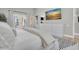 Relaxing bedroom with a balcony, a dresser, and minimalist artwork at 19 Crescent S Pl, St Petersburg, FL 33711