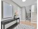 Inviting hallway with console table, decor, artwork, and stairway to upper level at 19 Crescent S Pl, St Petersburg, FL 33711
