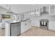 Well-lit kitchen boasting a center island, modern appliances, and a seamless flow to the living area at 19 Crescent S Pl, St Petersburg, FL 33711