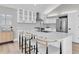 Beautiful kitchen featuring a large island, modern lighting, and stainless steel appliances at 19 Crescent S Pl, St Petersburg, FL 33711