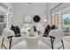 Beautiful living room featuring hardwood floors, stylish furniture, and access to the outdoor patio at 19 Crescent S Pl, St Petersburg, FL 33711