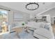 Cozy living room with an open layout, a modern chandelier, and comfortable seating at 19 Crescent S Pl, St Petersburg, FL 33711