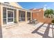 Inviting patio with an outdoor dining set, screened-in porch, and sunlit backyard at 19 Crescent S Pl, St Petersburg, FL 33711