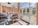Relaxing screened patio area with comfortable seating, ceiling fan, and views of outdoor living space at 19 Crescent S Pl, St Petersburg, FL 33711