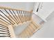 Bright stairway with modern wood and metal railings leads to the front door entrance at 19 Crescent S Pl, St Petersburg, FL 33711