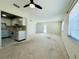 Open-concept living space combining the kitchen and living area with ample natural light at 203 Rickenbacker Dr, Sun City Center, FL 33573