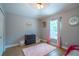 Bedroom with a plush pink rug, neutral walls, and natural light filtering through the window at 211 Royal Bonnet Dr, Apollo Beach, FL 33572