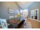 Charming dining room features a spacious table with bench seating and decor at 211 Royal Bonnet Dr, Apollo Beach, FL 33572