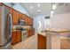 Modern kitchen with stainless steel appliances, granite countertops, ample cabinetry, and tile flooring at 211 Royal Bonnet Dr, Apollo Beach, FL 33572