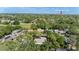 An aerial view shows several houses in a wooded neighborhood, near Safety Harbor at 25 Harbor Oaks Cir, Safety Harbor, FL 34695