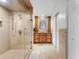 Spacious bathroom showcasing a glass-enclosed shower and wooden vanity with double sinks at 25 Harbor Oaks Cir, Safety Harbor, FL 34695