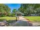 A shaded gazebo stands in the middle of a beautifully landscaped community park at 25 Harbor Oaks Cir, Safety Harbor, FL 34695