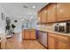 Modern kitchen with stainless-steel appliances and granite countertops, connecting to a dining area at 25 Harbor Oaks Cir, Safety Harbor, FL 34695