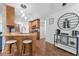 Kitchen featuring a breakfast bar, granite countertops, and modern stainless-steel appliances at 25 Harbor Oaks Cir, Safety Harbor, FL 34695