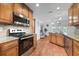 Well-equipped kitchen with stainless steel appliances and easy access to dining and patio areas at 25 Harbor Oaks Cir, Safety Harbor, FL 34695