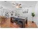 Bright living and dining area with a large table and easy access to the outdoor patio at 25 Harbor Oaks Cir, Safety Harbor, FL 34695