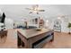 Spacious open-concept living area featuring a large table and comfortable seating arrangements at 25 Harbor Oaks Cir, Safety Harbor, FL 34695