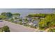 An aerial view shows a marina with many sailboats docked along a waterfront at 25 Harbor Oaks Cir, Safety Harbor, FL 34695