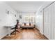 Office space with wood floors, futon, desk, and closet space at 25 Harbor Oaks Cir, Safety Harbor, FL 34695