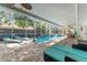 Enclosed pool and patio area with comfortable seating and dining spaces at 25 Harbor Oaks Cir, Safety Harbor, FL 34695