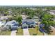 Aerial view of a two-story house with a spacious yard and a detached garage at 3612 W Pearl Ave, Tampa, FL 33611