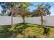 Large, fenced backyard with a wooden pergola at 3612 W Pearl Ave, Tampa, FL 33611
