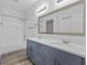 Bright bathroom with double vanity, modern fixtures, and subway tile shower and tub at 3612 W Pearl Ave, Tampa, FL 33611