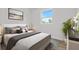 Bedroom with a window and neutral decor at 3612 W Pearl Ave, Tampa, FL 33611