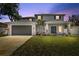 Charming two-story home boasts a well-manicured lawn and a spacious two-car garage at 3612 W Pearl Ave, Tampa, FL 33611