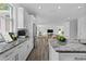 Modern kitchen with granite countertops, stainless steel appliances and a view to dining room at 3612 W Pearl Ave, Tampa, FL 33611