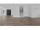 Spacious living room with wood flooring, double front doors and staircase at 3612 W Pearl Ave, Tampa, FL 33611