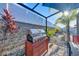 Outdoor kitchen area featuring a stainless steel grill and lush landscaping at 36454 Flats St, Zephyrhills, FL 33541