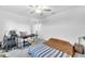 Bedroom with ceiling fan, work station and a large closet at 36454 Flats St, Zephyrhills, FL 33541