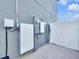 Exterior of the home with solar panels and an electric car charging station and a gate to the backyard at 36454 Flats St, Zephyrhills, FL 33541