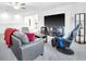 Spacious living room featuring a modern entertainment center, plush seating, and neutral decor at 36454 Flats St, Zephyrhills, FL 33541