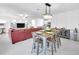 Bright, open-concept living space with modern finishes and dining area adjacent to open kitchen at 36454 Flats St, Zephyrhills, FL 33541