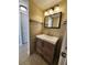 Modern bathroom vanity with stylish fixtures, complemented by tiled walls at 379 47Th N Ave # 104, St Petersburg, FL 33703
