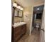 Bathroom featuring modern vanity, mirror, and walk-in shower with stylish shower curtain at 379 47Th N Ave # 104, St Petersburg, FL 33703