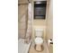 Bathroom showcasing a toilet, shower, and storage cabinet at 379 47Th N Ave # 104, St Petersburg, FL 33703