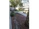 Building exterior with manicured landscape and a seating area with pergola at 379 47Th N Ave # 104, St Petersburg, FL 33703
