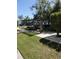 A picnic area with benches sits on a patch of grass next to a condominium at 379 47Th N Ave # 104, St Petersburg, FL 33703