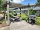 Community grilling area featuring charcoal and propane grills and picnic tables at 379 47Th N Ave # 104, St Petersburg, FL 33703