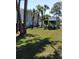 Parklane Condominiums sign surrounded by palm trees and lush green grass at 379 47Th N Ave # 104, St Petersburg, FL 33703