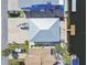 Overhead view of three waterfront homes with lush landscaping, private docks, and boat parking at 4039 Casa Ct, Hernando Beach, FL 34607