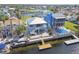 Aerial view of waterfront homes with backyard pools and docks, showcasing the coastal neighborhood at 4039 Casa Ct, Hernando Beach, FL 34607