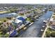 Extensive aerial showcases a waterfront neighborhood with various homes, docks, boat lifts, and beautiful waterways at 4039 Casa Ct, Hernando Beach, FL 34607