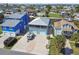 Home featuring a garage, boat on trailer, and waterfront canal access at 4039 Casa Ct, Hernando Beach, FL 34607