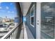 Long balcony with dark railing and partial privacy screen, offering views of the neighborhood and boat parking at 4039 Casa Ct, Hernando Beach, FL 34607